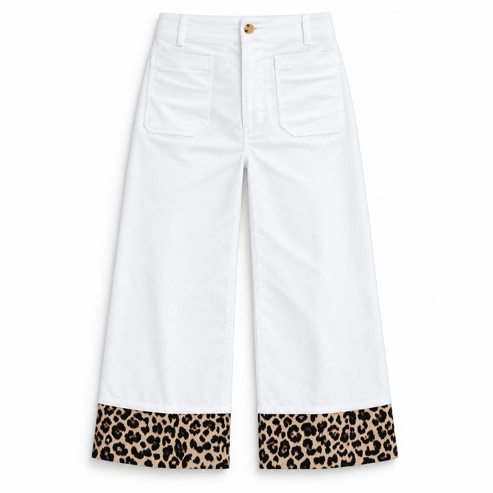 White cropped pants with leopard print cuffs, shown flat against a white background.