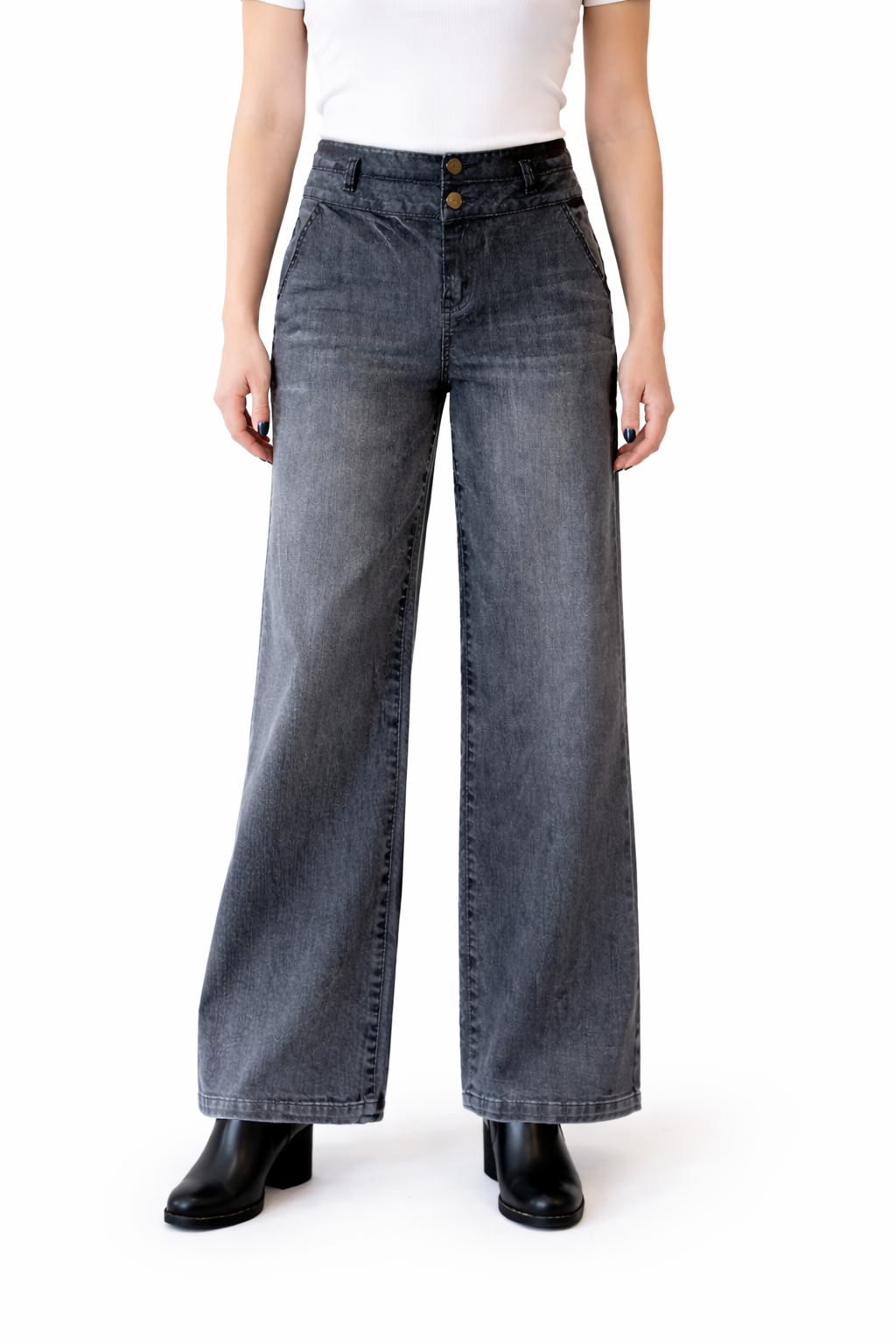 Person wearing wide-leg jeans on a white background