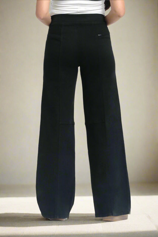 Black wide-leg pants worn by a person on a white background