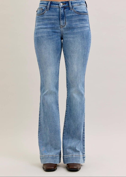 Blue jeans on a plain background