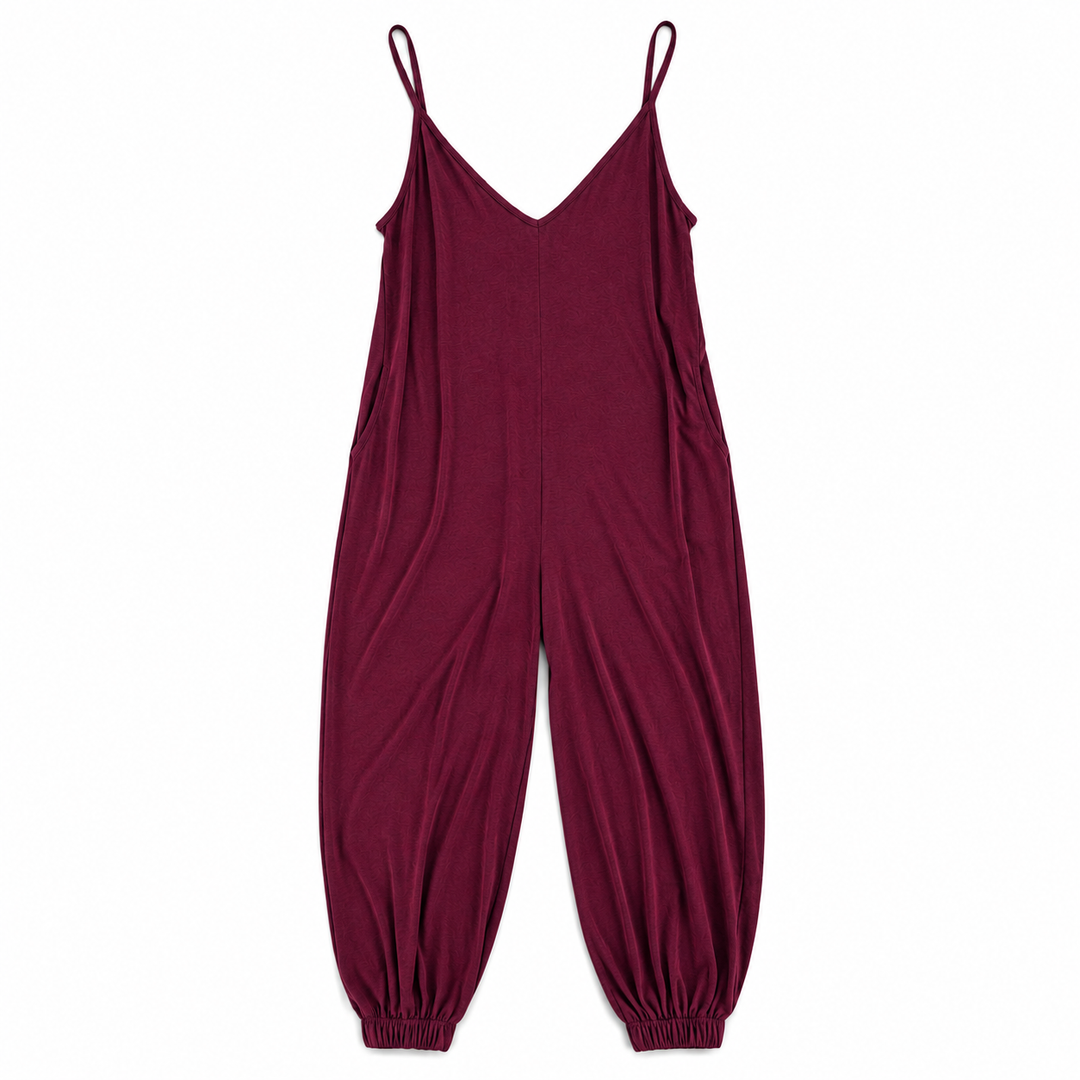 A burgundy sleeveless jumpsuit with thin shoulder straps, a V-neckline, and elasticized cuffed harem-style legs, shown flat against a plain white background.