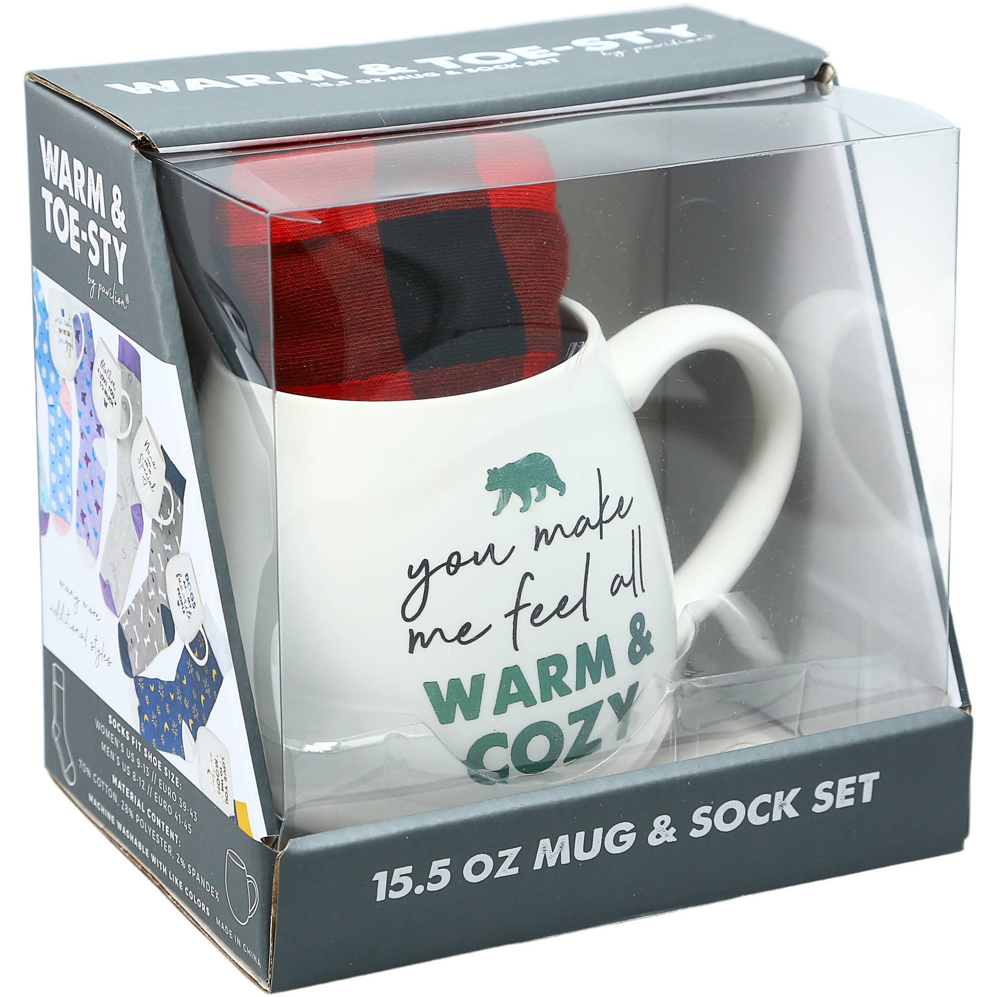 Mug and sock set in packaging with text 'you make me feel all warm & cozy'.