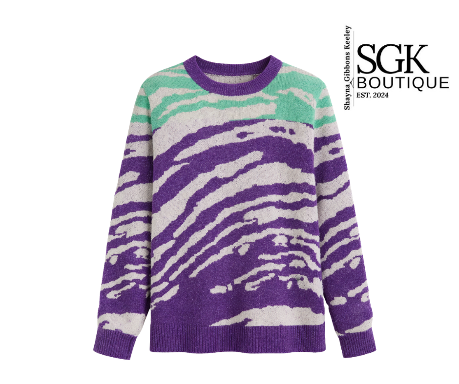Purple and green patterned sweater with SGK Boutique logo on a white background