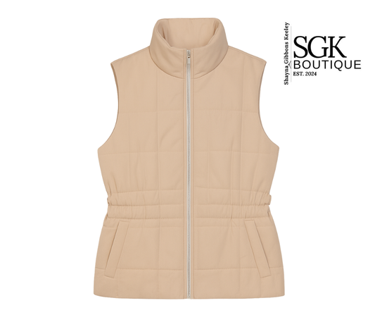 Beige vest with a zipper on a white background, featuring the SGK Boutique logo.