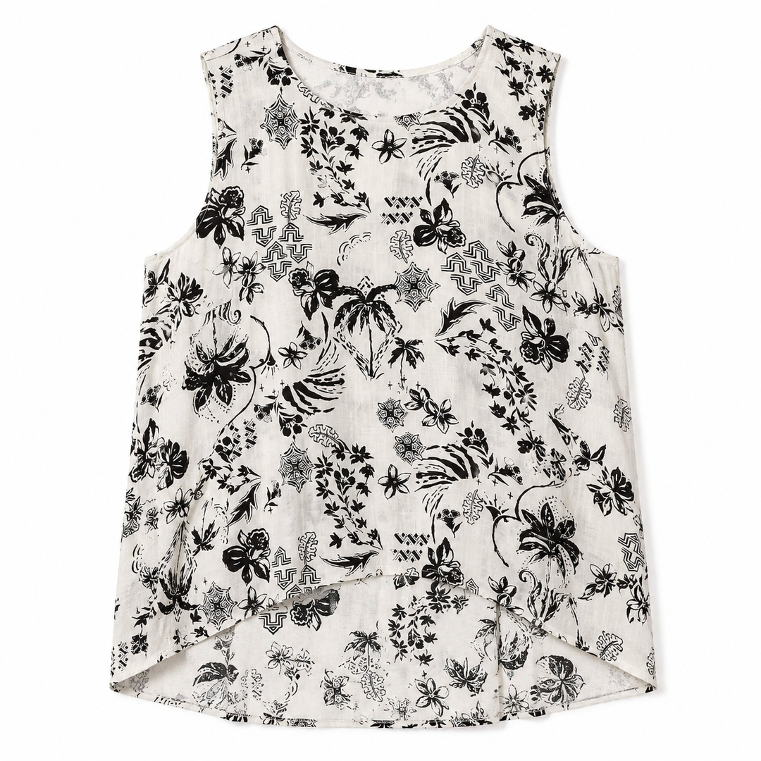 White sleeveless top with black floral pattern on a white background