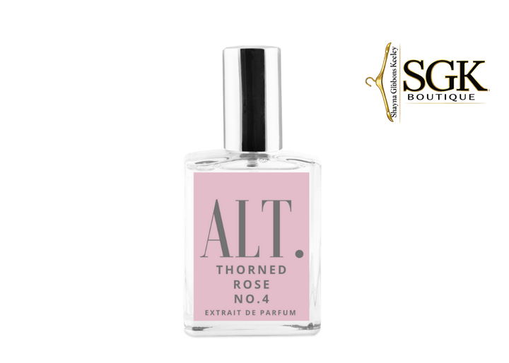 Perfume bottle with pink label and SGK Boutique logo on a white background