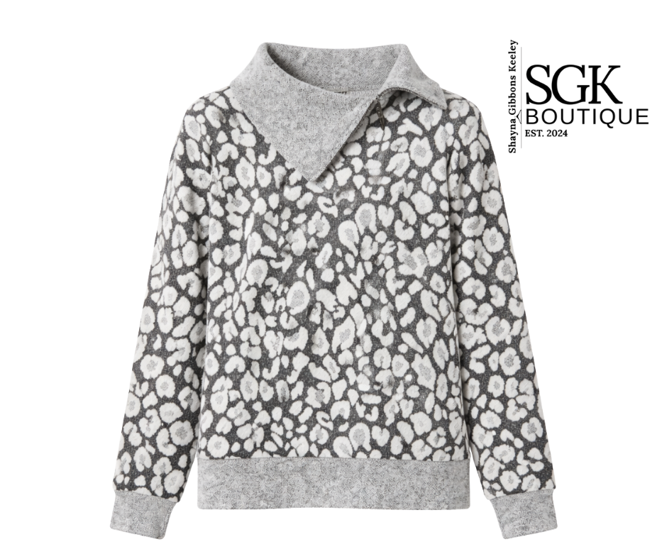 Gray sweater with white floral pattern on a white background, featuring SGK Boutique logo.