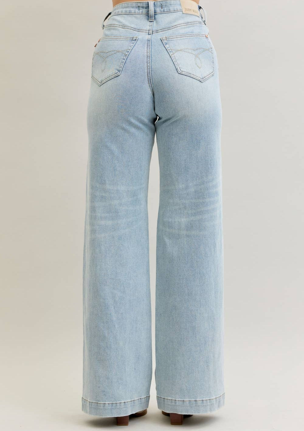 Light blue jeans on a plain background