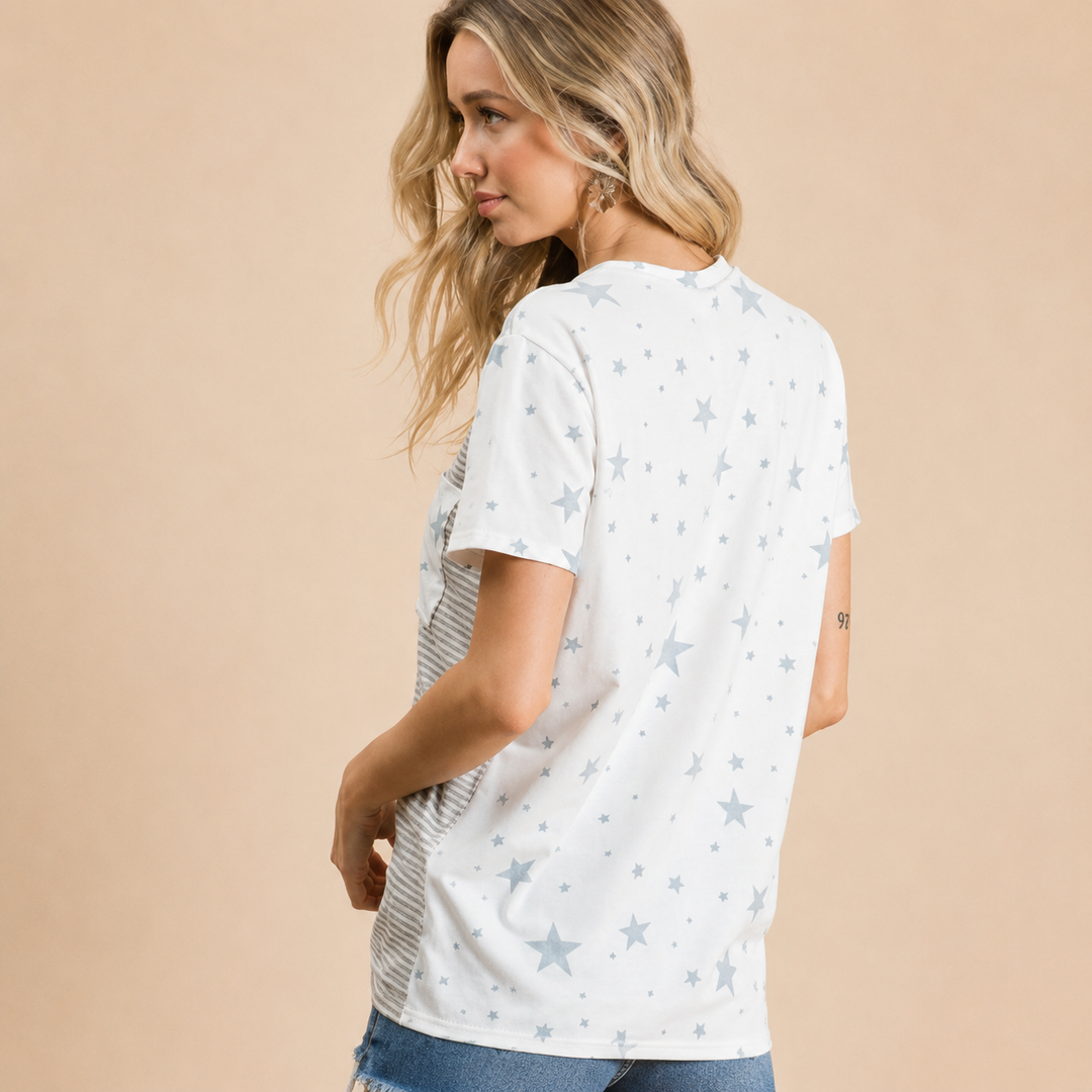 Woman wearing a white t-shirt with star pattern on a beige background