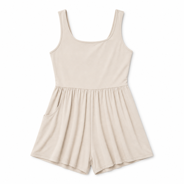Beige romper on a white background