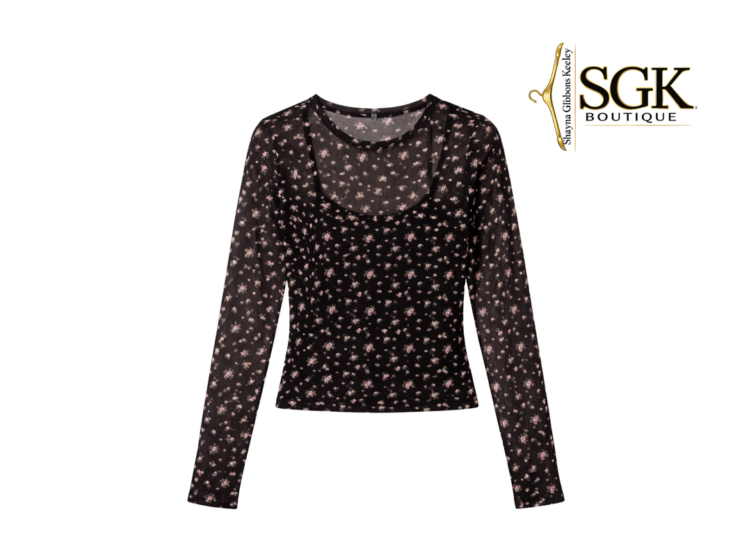 Black long-sleeve top with star pattern on a white background, featuring SGK Boutique logo.