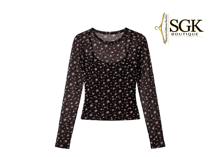 Black long-sleeve top with star pattern on a white background, featuring SGK Boutique logo.