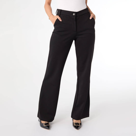 Black pants worn by a person on a white background
