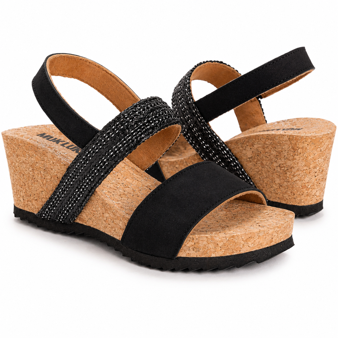 Black wedge sandals with cork sole on a white background