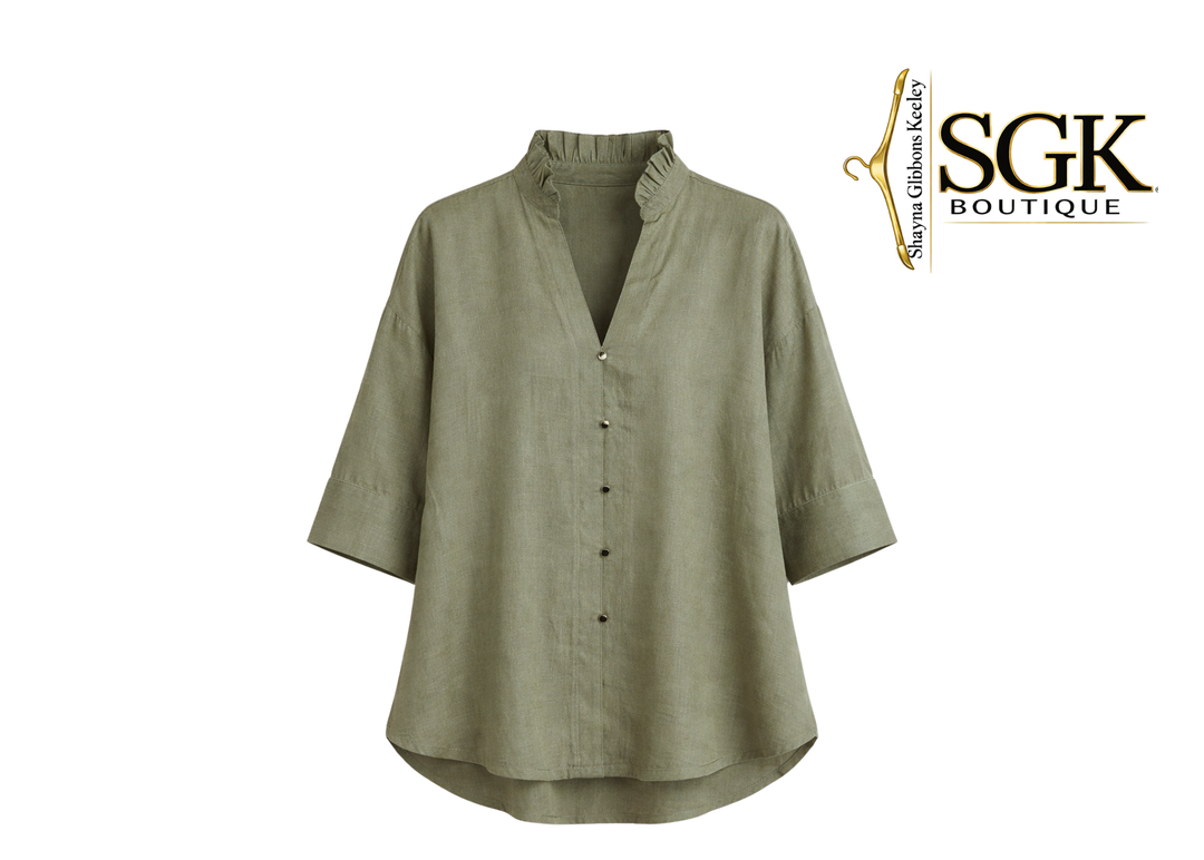 Green shirt on a white background with SGK Boutique logo.