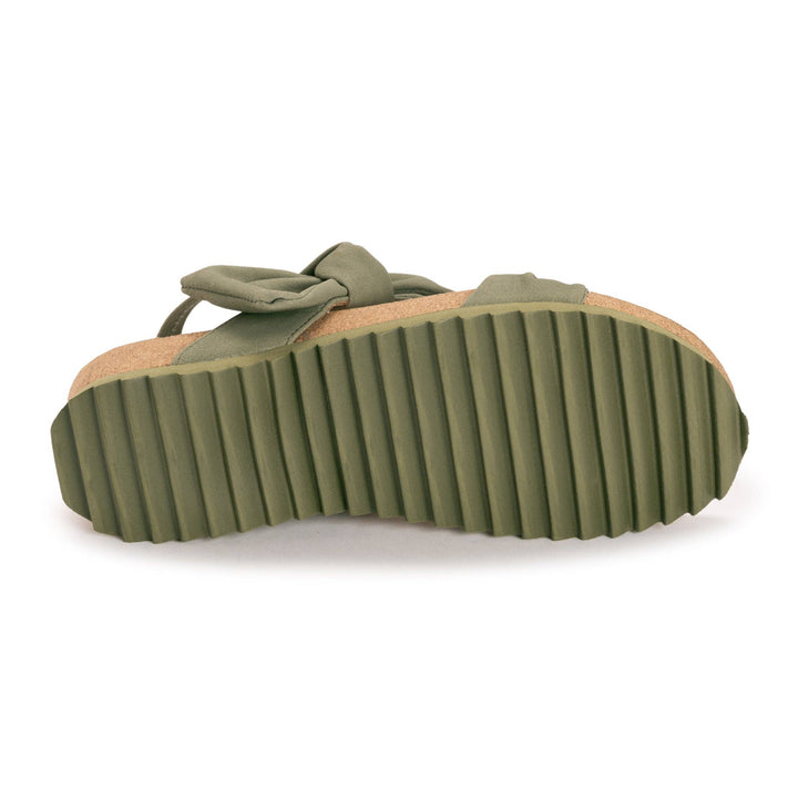Green sandal with a platform sole on a white background