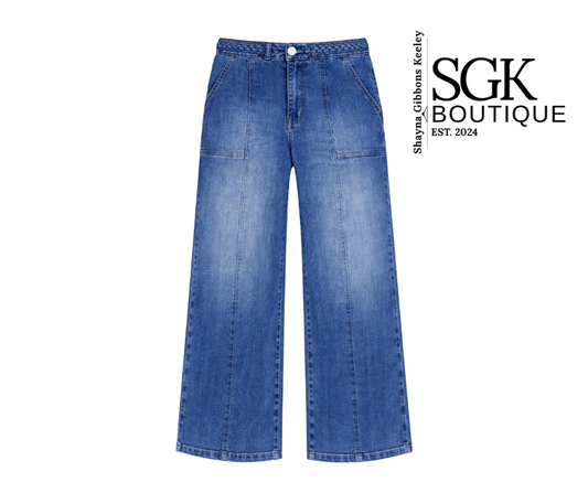 Blue jeans with SGK Boutique logo on a white background