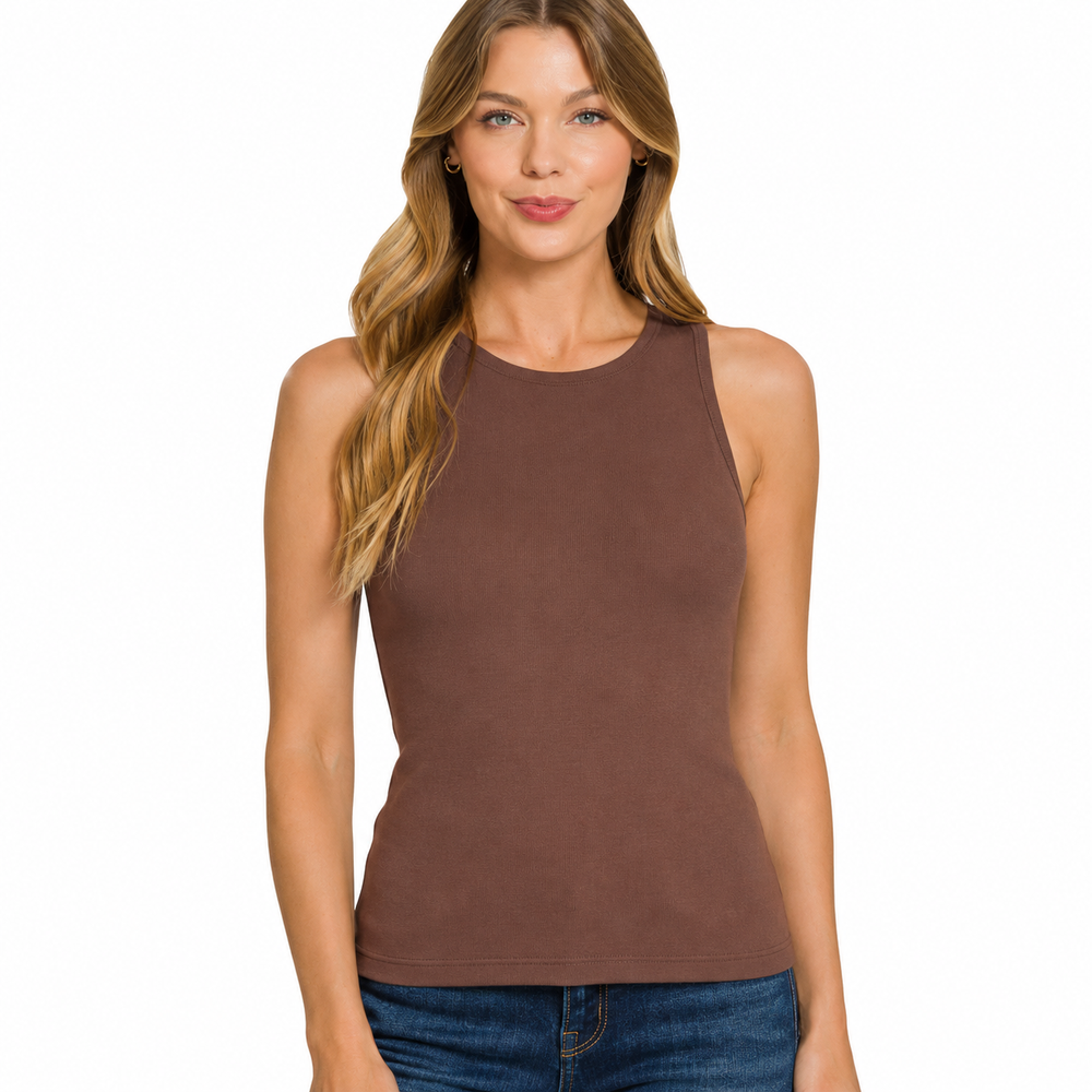A woman modeling a sleeveless, high-neck tank top in a solid medium brown color, paired with blue jeans, against a plain white background.