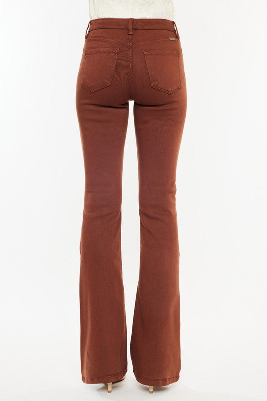Brown flared jeans on a white background