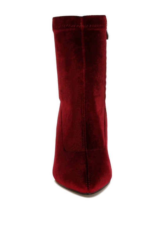 Red suede boot on a white background