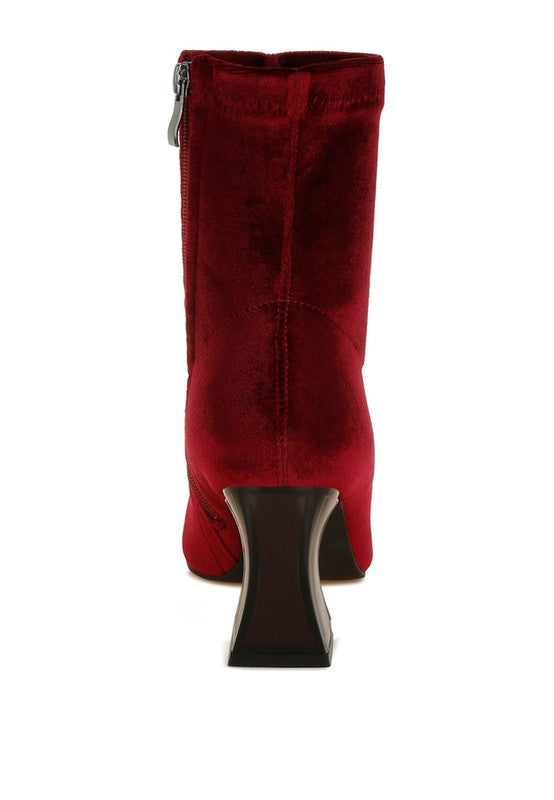 Red boot with a block heel on a white background