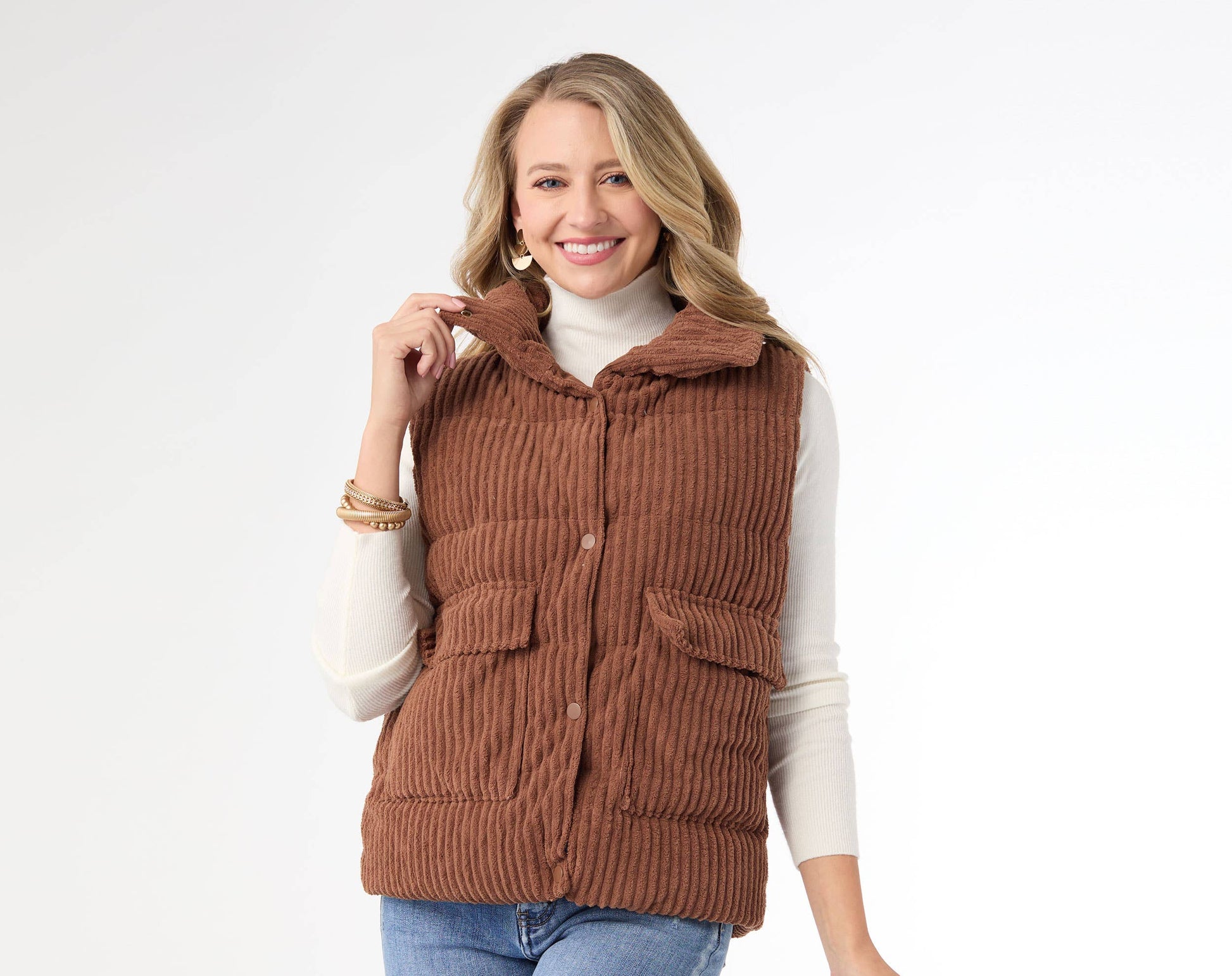 Woman wearing a brown corduroy vest on a white background