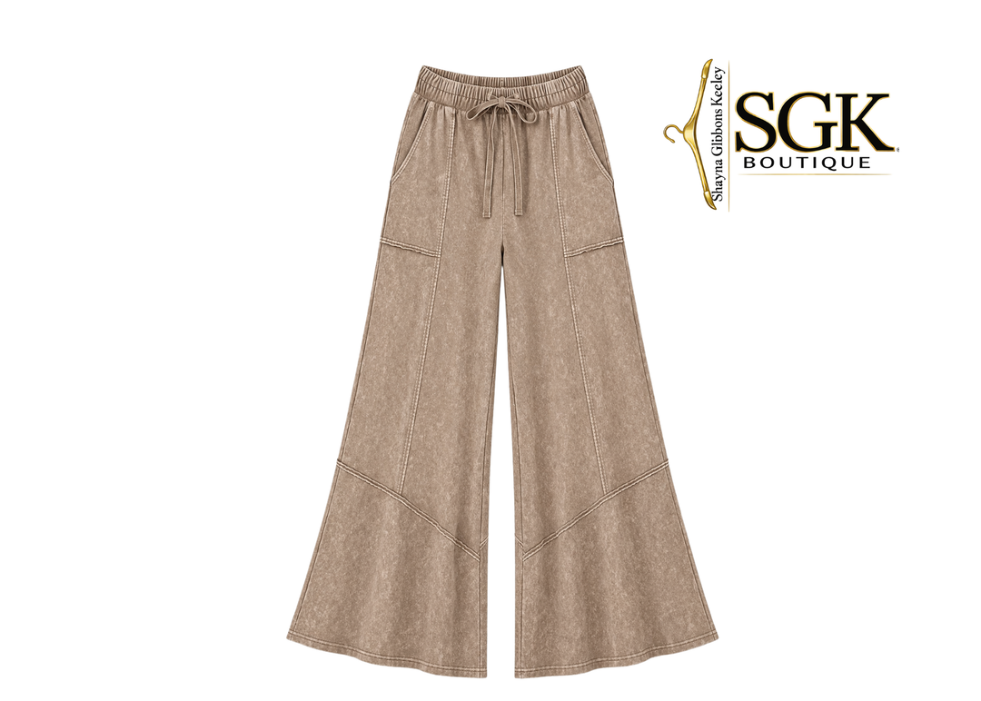 Beige wide-leg pants with drawstring waist on a white background, featuring the SGK Boutique logo.