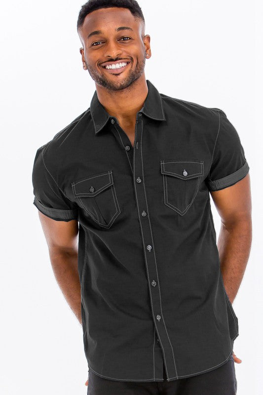 Man wearing a black short-sleeve shirt on a white background