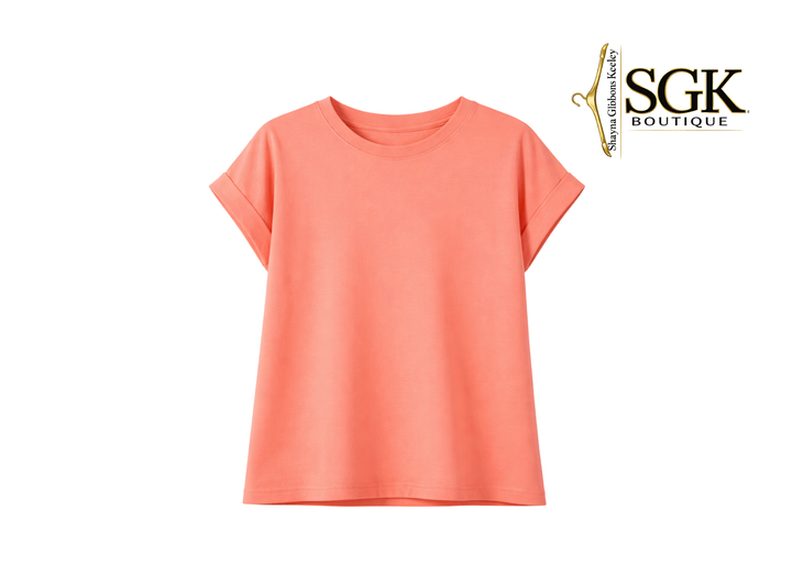 Coral t-shirt on a white background with SGK Boutique logo.