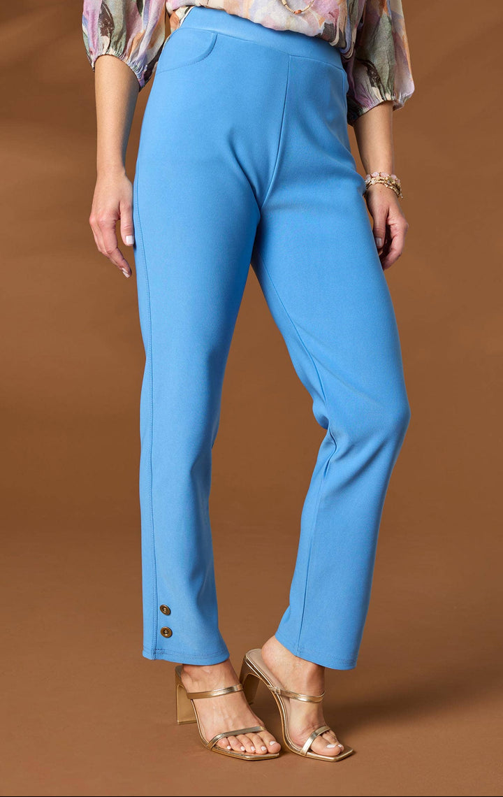 Person wearing blue pants with a brown background