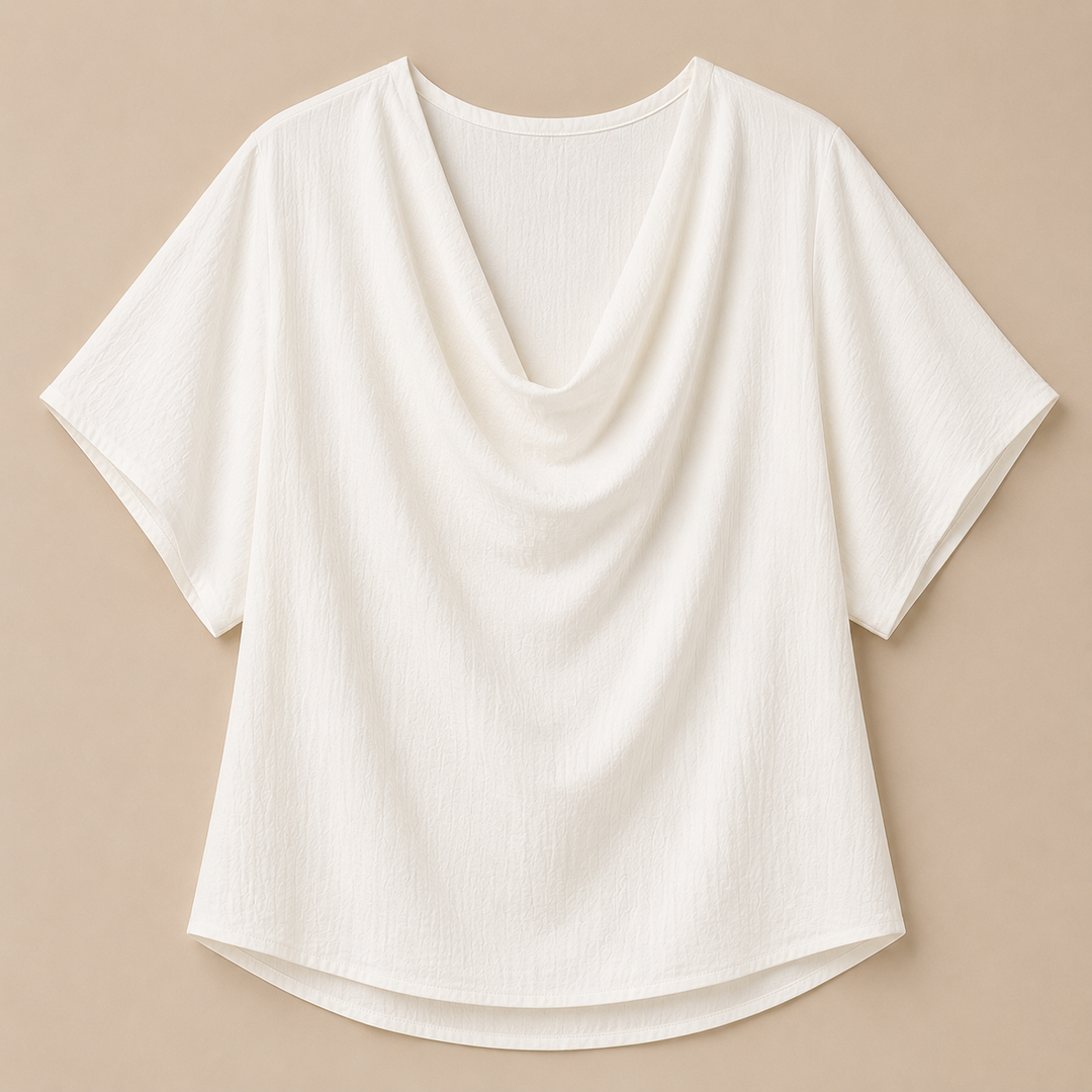 White blouse with draped neckline on a beige background