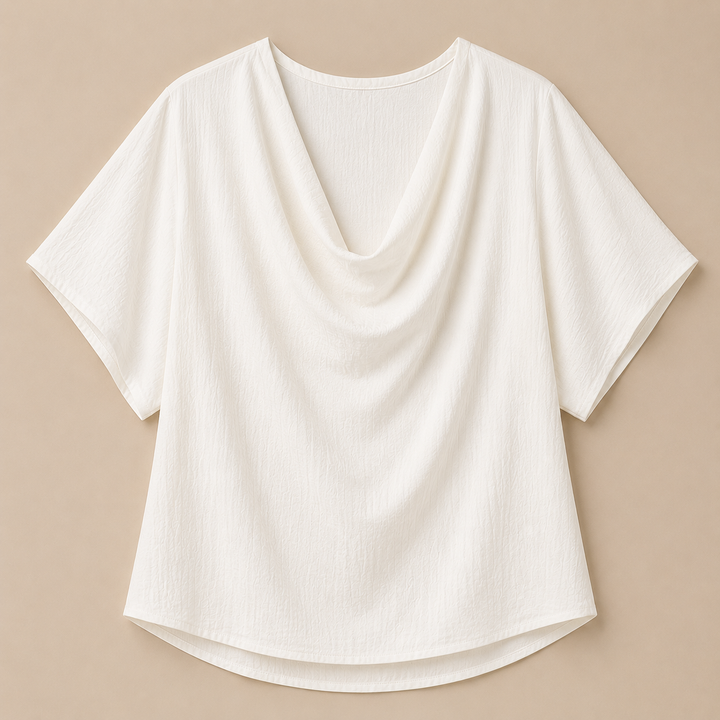 White blouse with draped neckline on a beige background