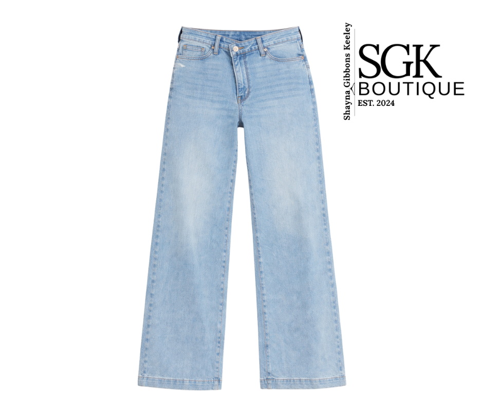 Light blue jeans on a white background with SGK Boutique logo.