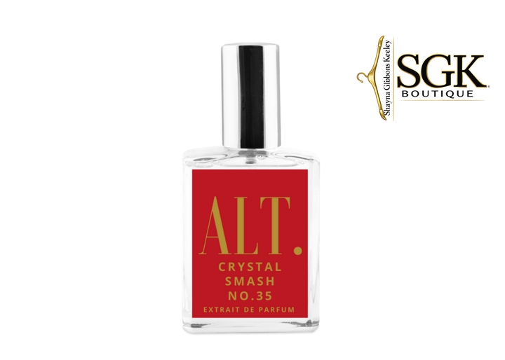 Perfume bottle with red label and silver cap on a white background, featuring SGK Boutique logo.