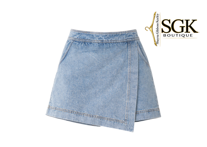Denim skirt on a white background with SGK Boutique logo.
