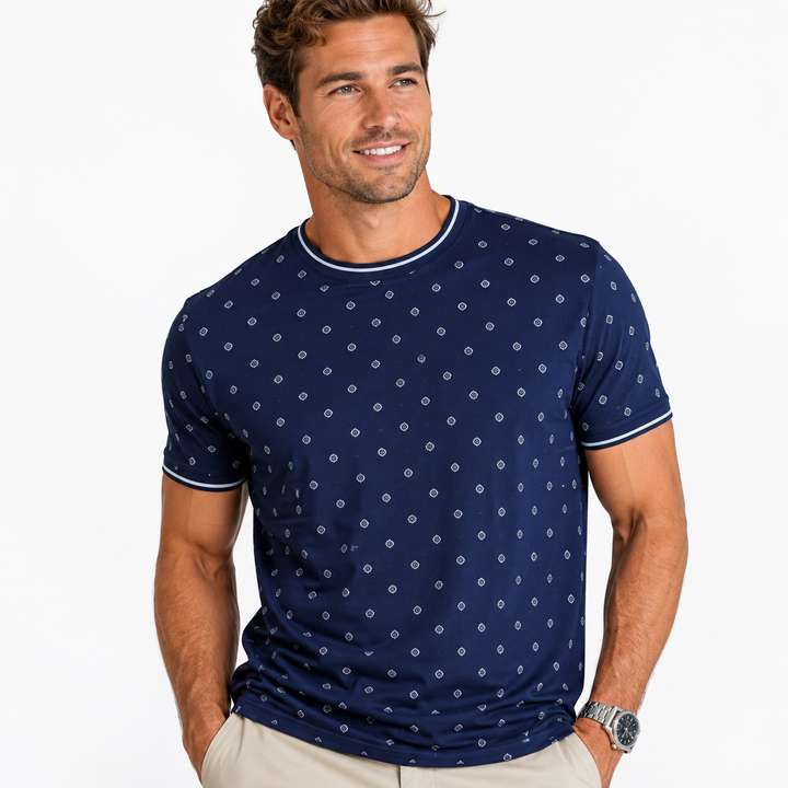 Man wearing a navy blue t-shirt with a white pattern on a white background
