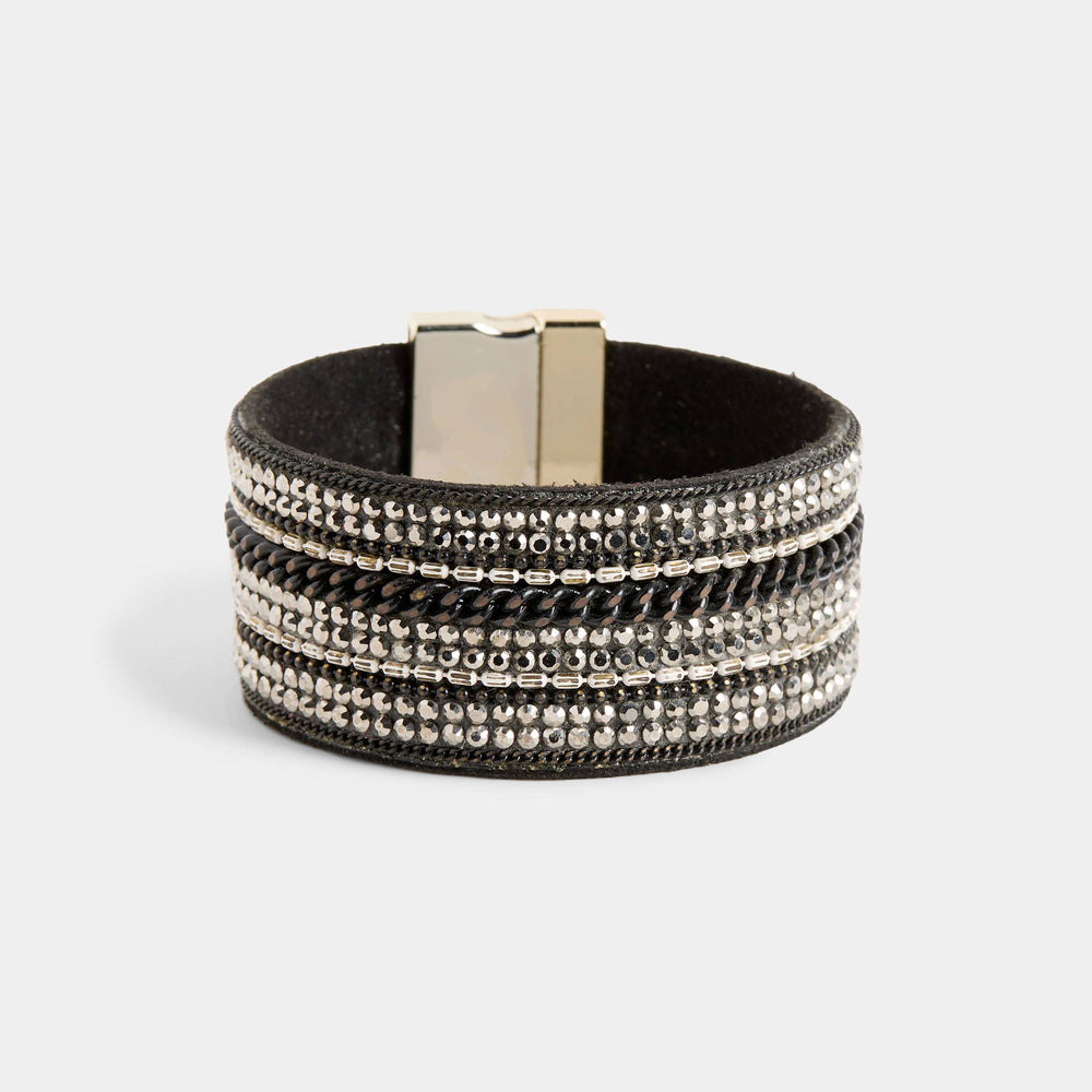 Multistrand bracelet with metallic clasp on a light gray background