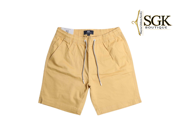 Beige shorts with a drawstring on a white background, featuring the SGK Boutique logo.