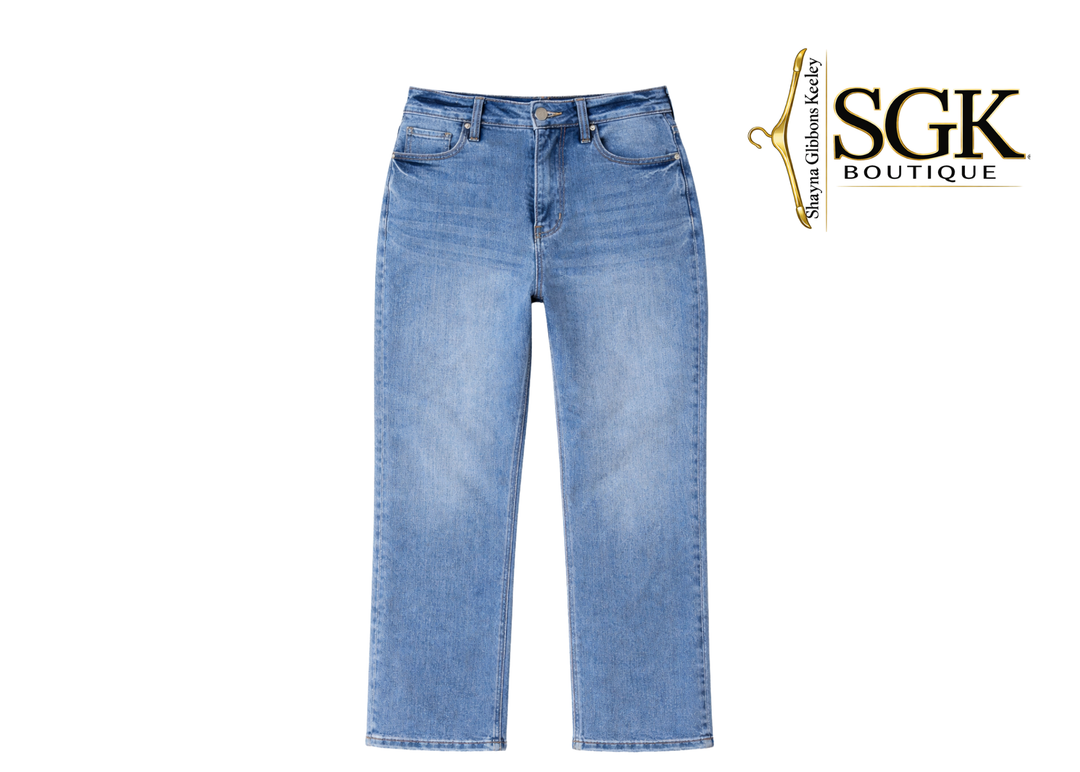 Light blue jeans on a white background with SGK Boutique logo.