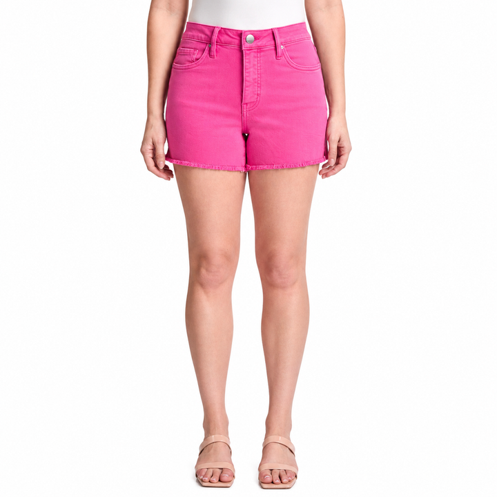 Person wearing bright pink denim shorts on a white background
