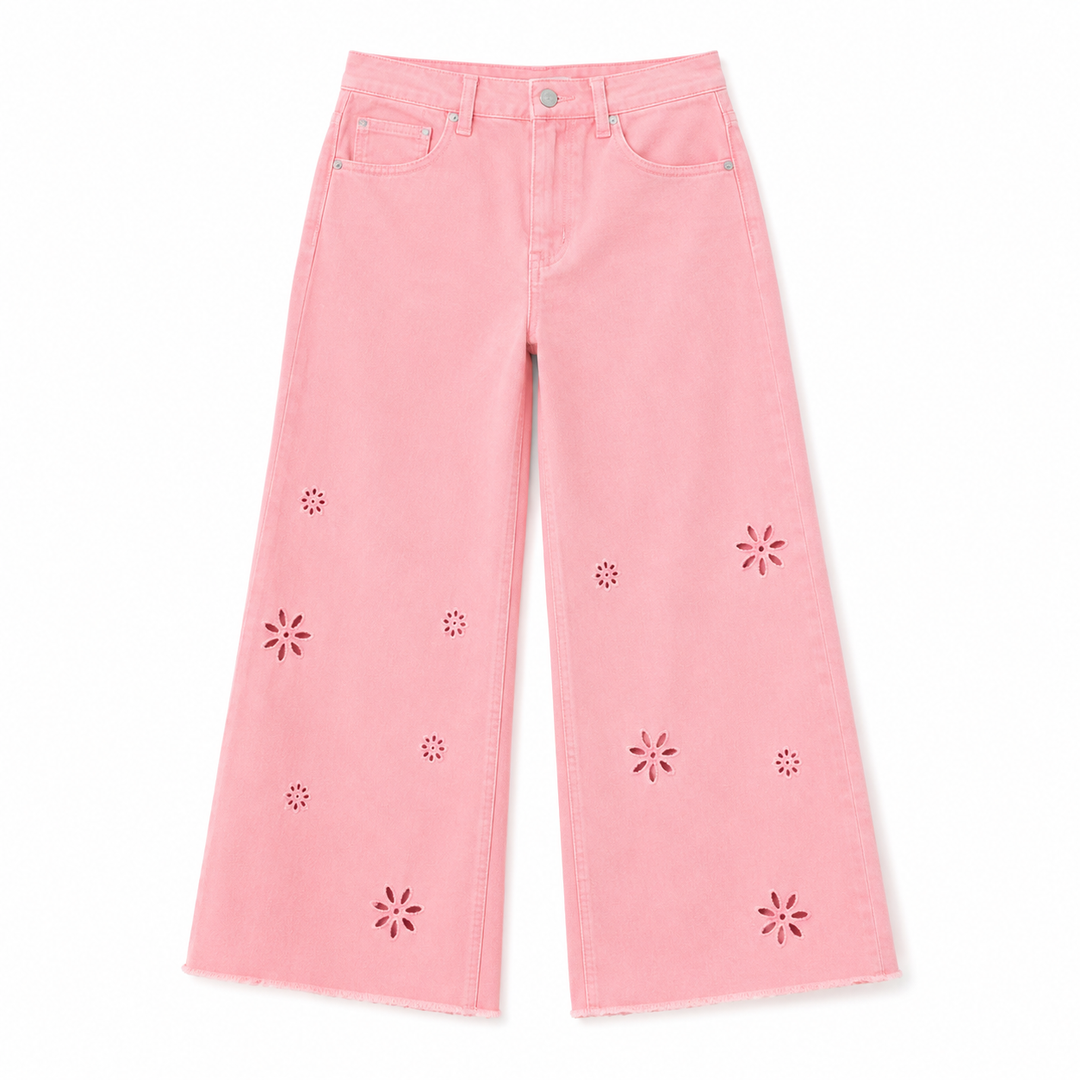 Pink jeans with floral cutouts on a white background