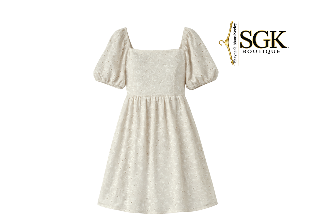 Beige dress with puff sleeves on a white background, featuring the SGK Boutique logo.