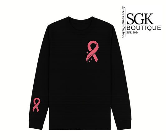 Black long-sleeve shirt with pink ribbon design on a white background, featuring SGK Boutique logo.