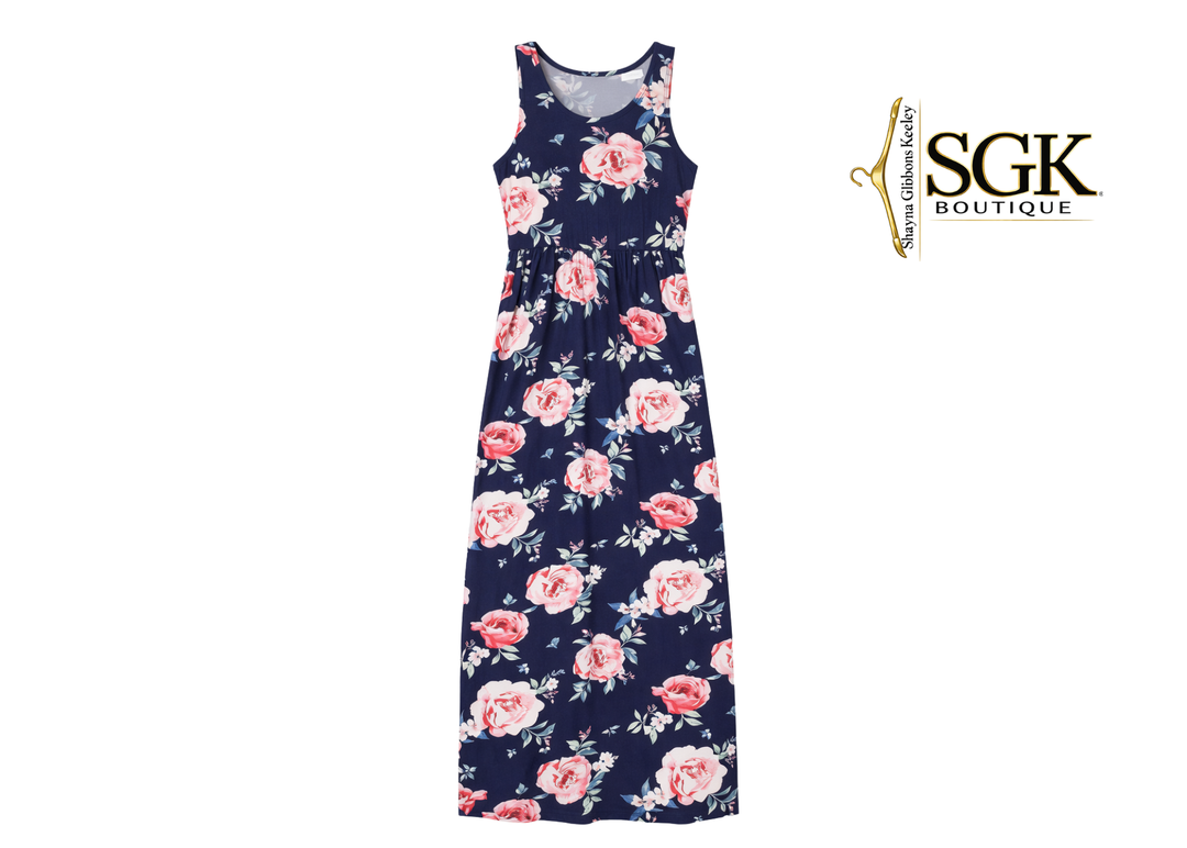 Floral dress with pink flowers on a navy background, featuring the SGK Boutique logo.