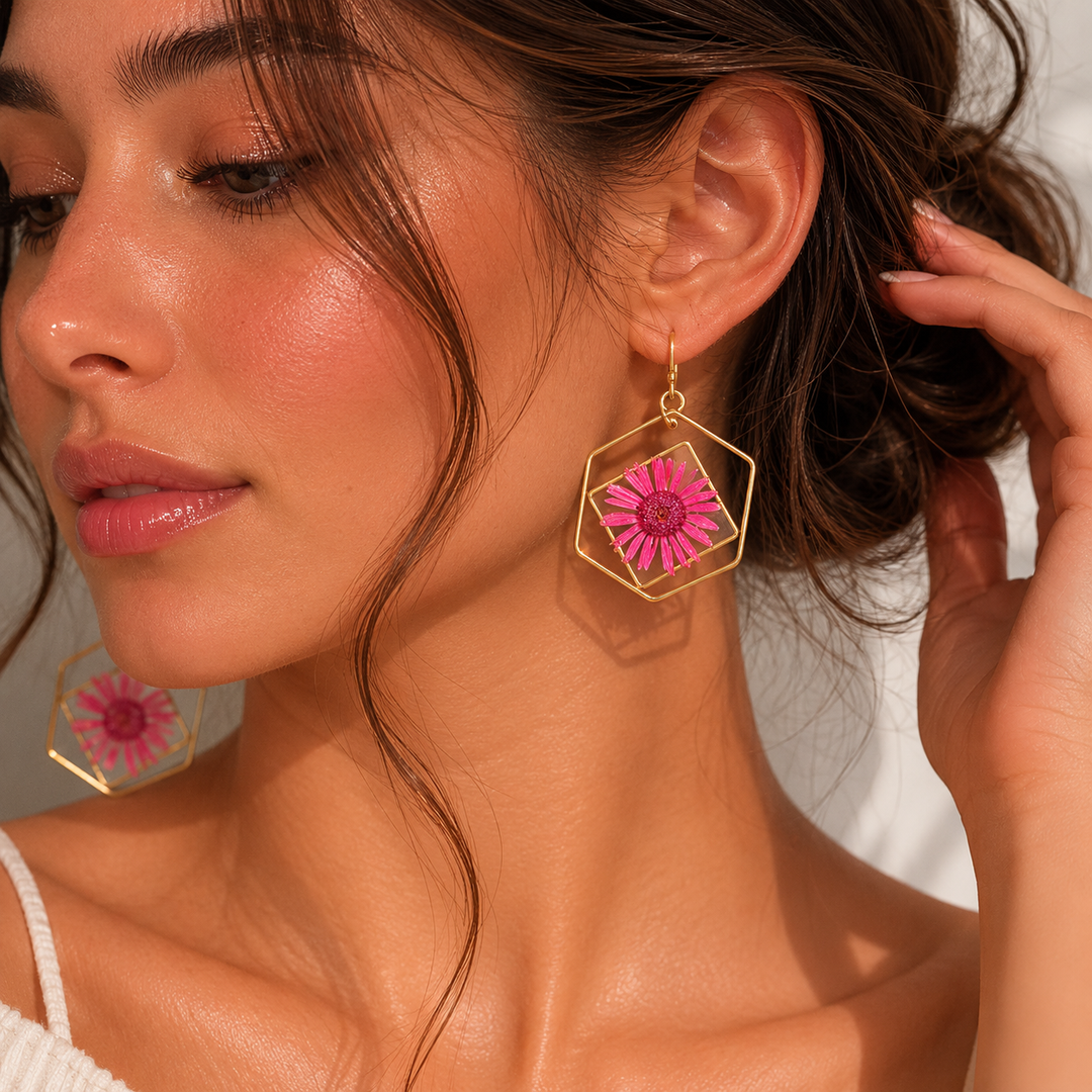 Close-up of a woman wearing pink flower earrings with a neutral background
