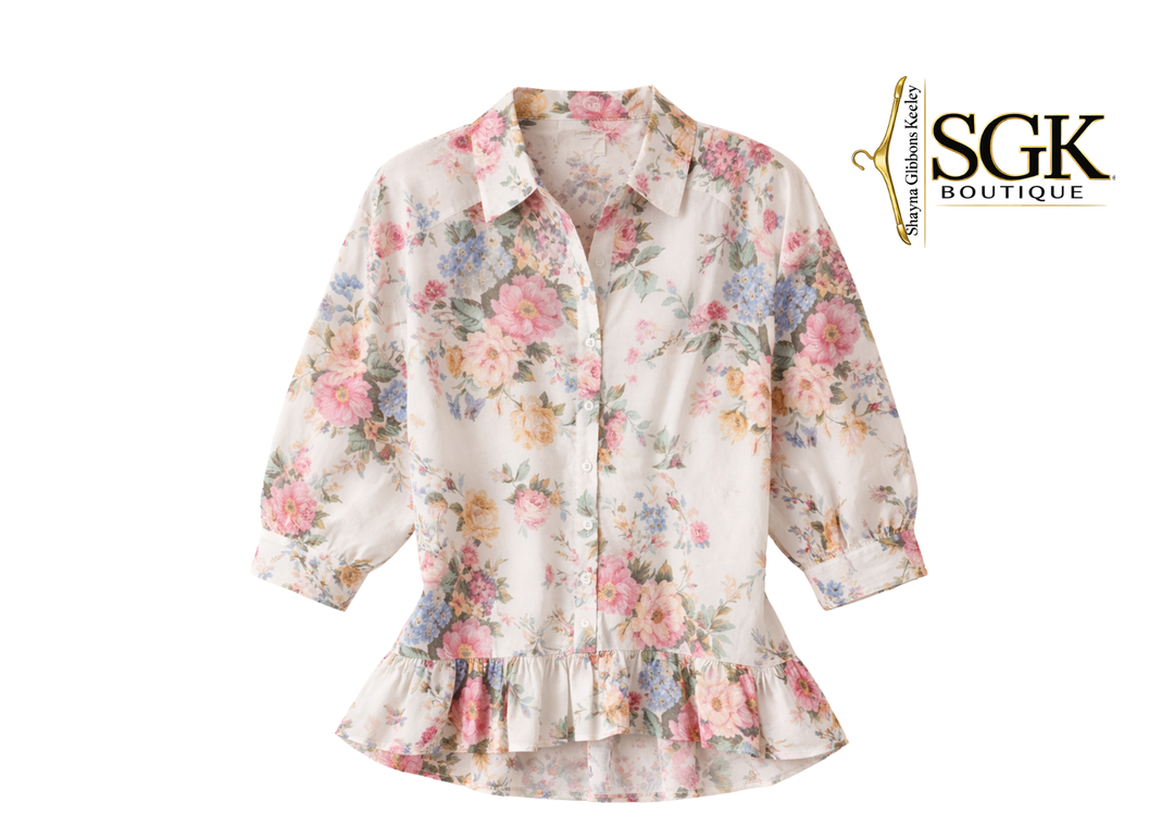 Floral blouse with ruffled hem on a white background, featuring the SGK Boutique logo.