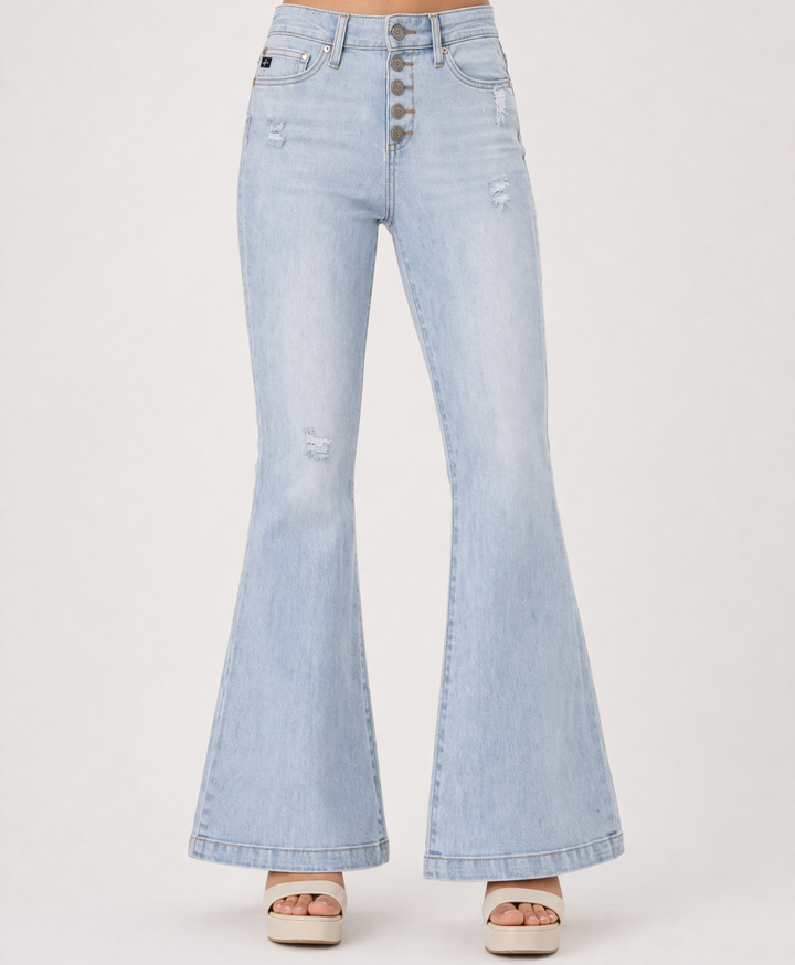 Light blue flared jeans on a white background