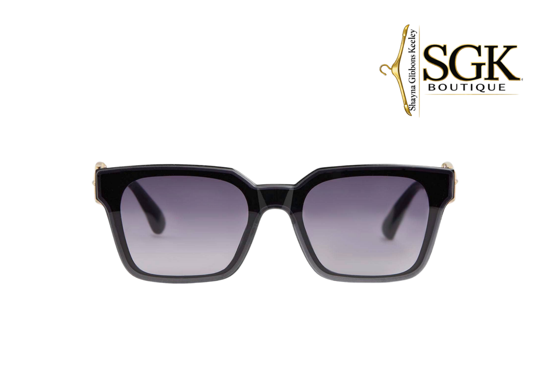 Black sunglasses with gradient lenses on a white background, featuring the SGK Boutique logo.