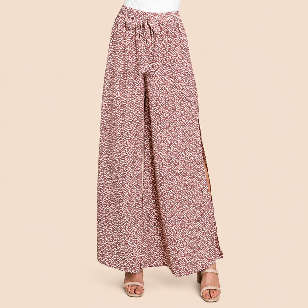 Floral patterned wide-leg pants on a beige background