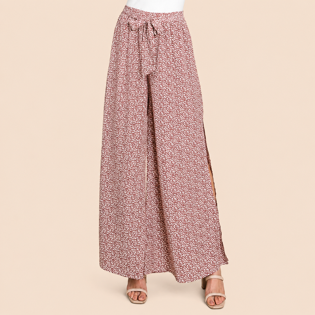 Floral patterned wide-leg pants on a beige background